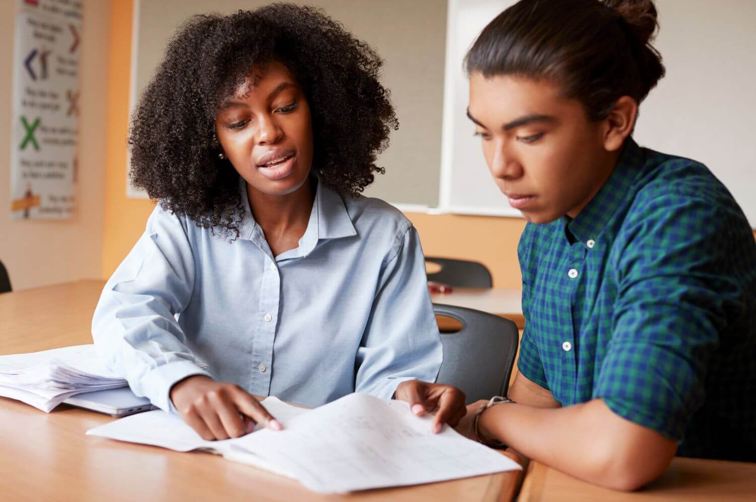 tutor and student working on hw