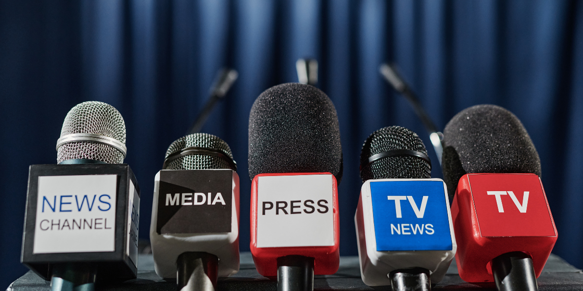ive news microphones with labels including NEWS CHANNEL, MEDIA, PRESS, and TV NEWS arranged together for student newspaper journalism training