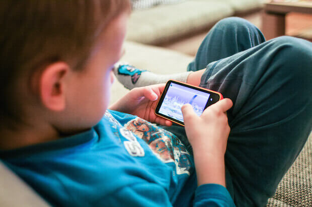 educational youtube channels featured image of kid on smartphone