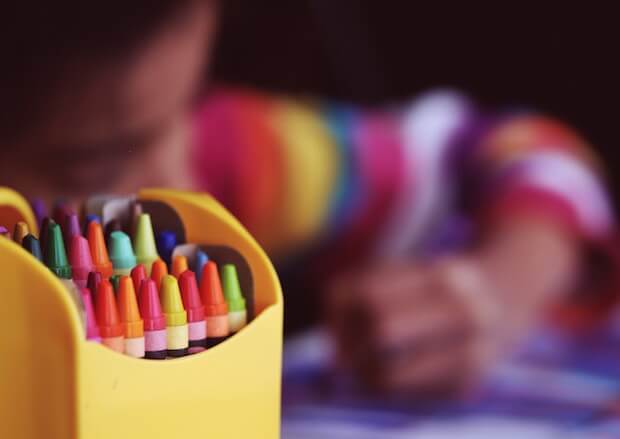 crayons and child colouring - educational teacher looping article featured image