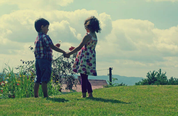 kids holding hands - teach conflict resolution to kids article featured image