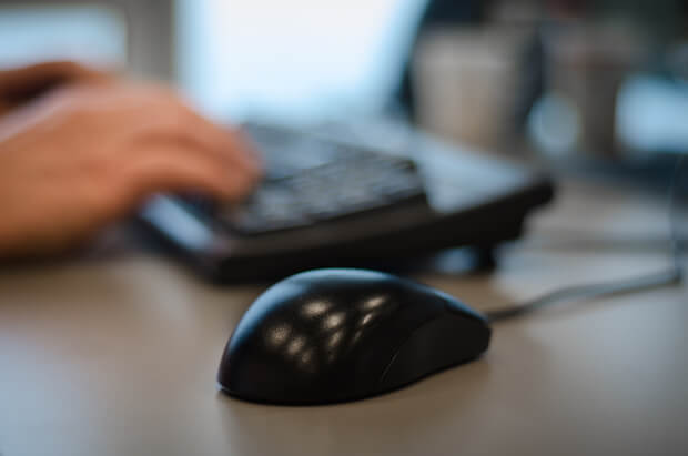 mouse, hands and keyboard - image for article on teaching kids newspaper layout and design and desktop publishing