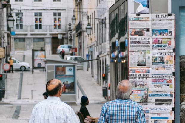 article featured image for teaching kids the elements of a news story - men standing at news stand