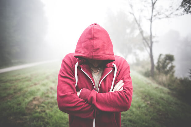 boy in hoodie outside - teach teens personal hygiene lessons article featured image