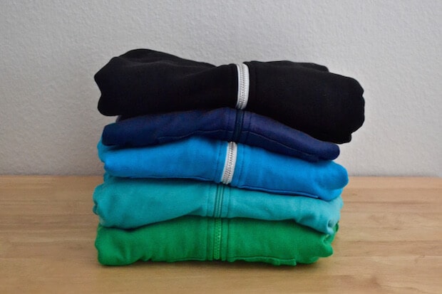 sweaters in a pile - featured image for teaching kids about sweatshops and fashion