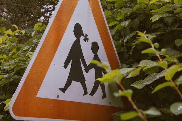Street sign with kids crossing 
