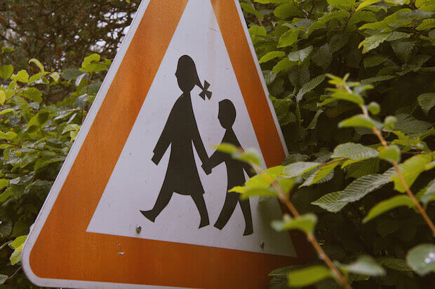 Street sign with kids crossing