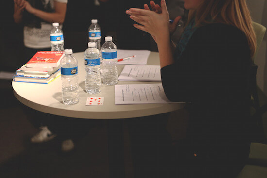 kids staying hydrated featured image - water bottles on desk with students